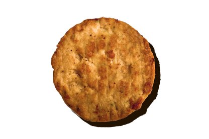 A cooked Daring Plant-Based Unbreaded Gluten-Free Chicken Patty shown from a top-down perspective