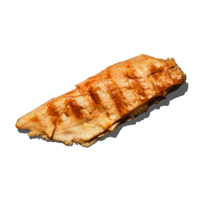 A single grilled Daring Plant-Based Unbreaded Gluten-Free Chicken Piece with visible grill marks and a glossy glaze