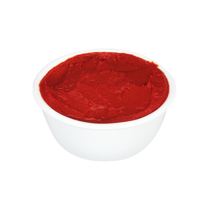 Red tomato paste in a white bowl