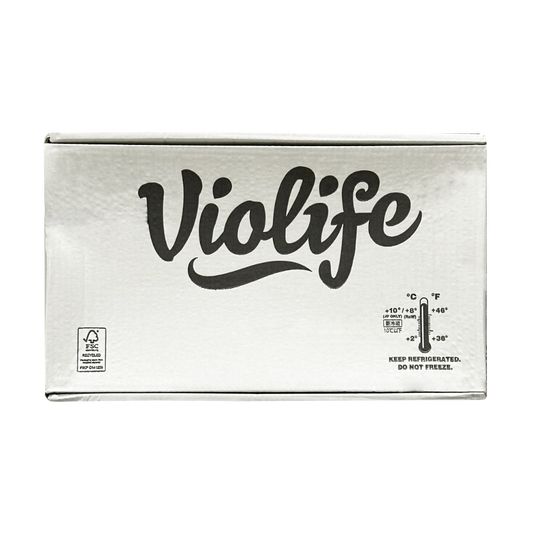 A white box of 24 lb Violife Just Like Cream Cheese with a picture of a thermometer and instructions to keep refrigerated but do not freeze.